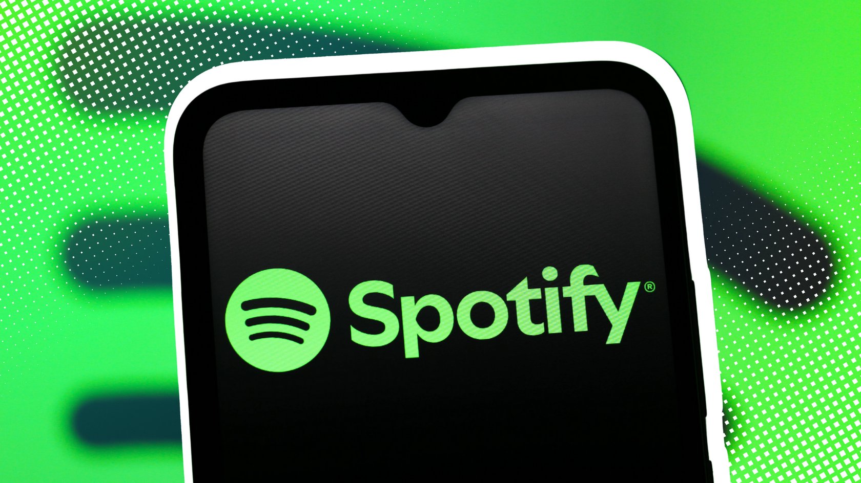 Das Spotify-Logo auf einem Smartphone. Das Spotify-Logo auf einem Smartphone.