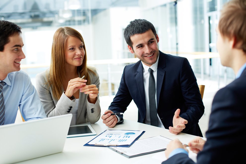 Image of business partners discussing documents