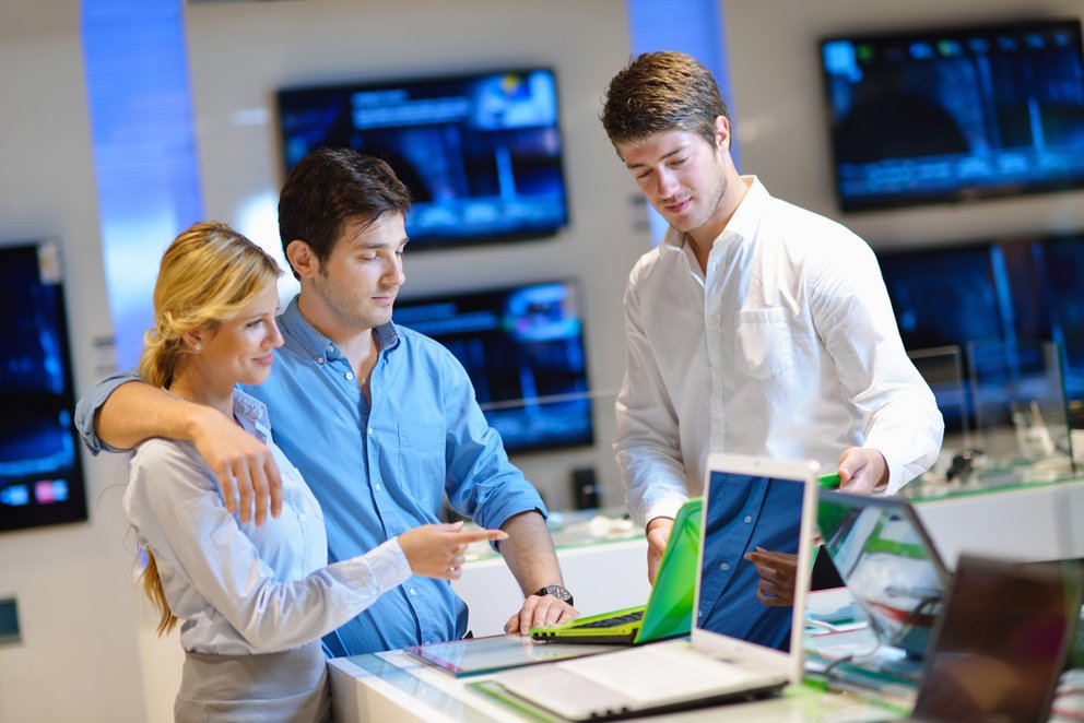Young couple in consumer electronics store