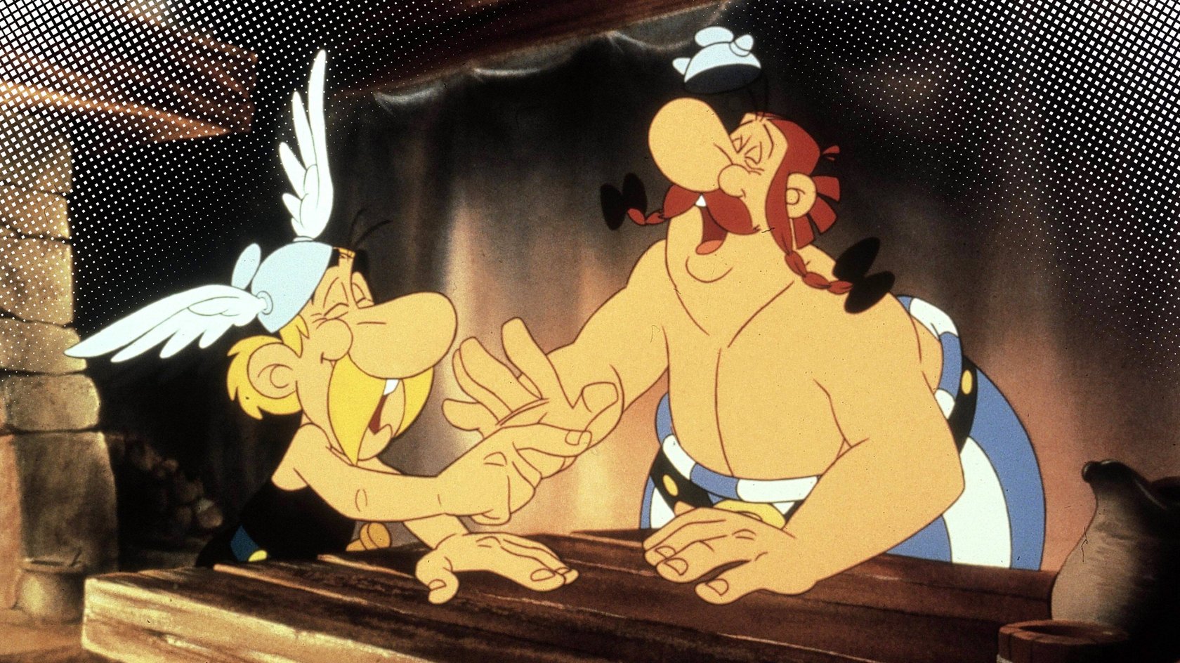 Asteric und Obelix lachen an einem Tisch