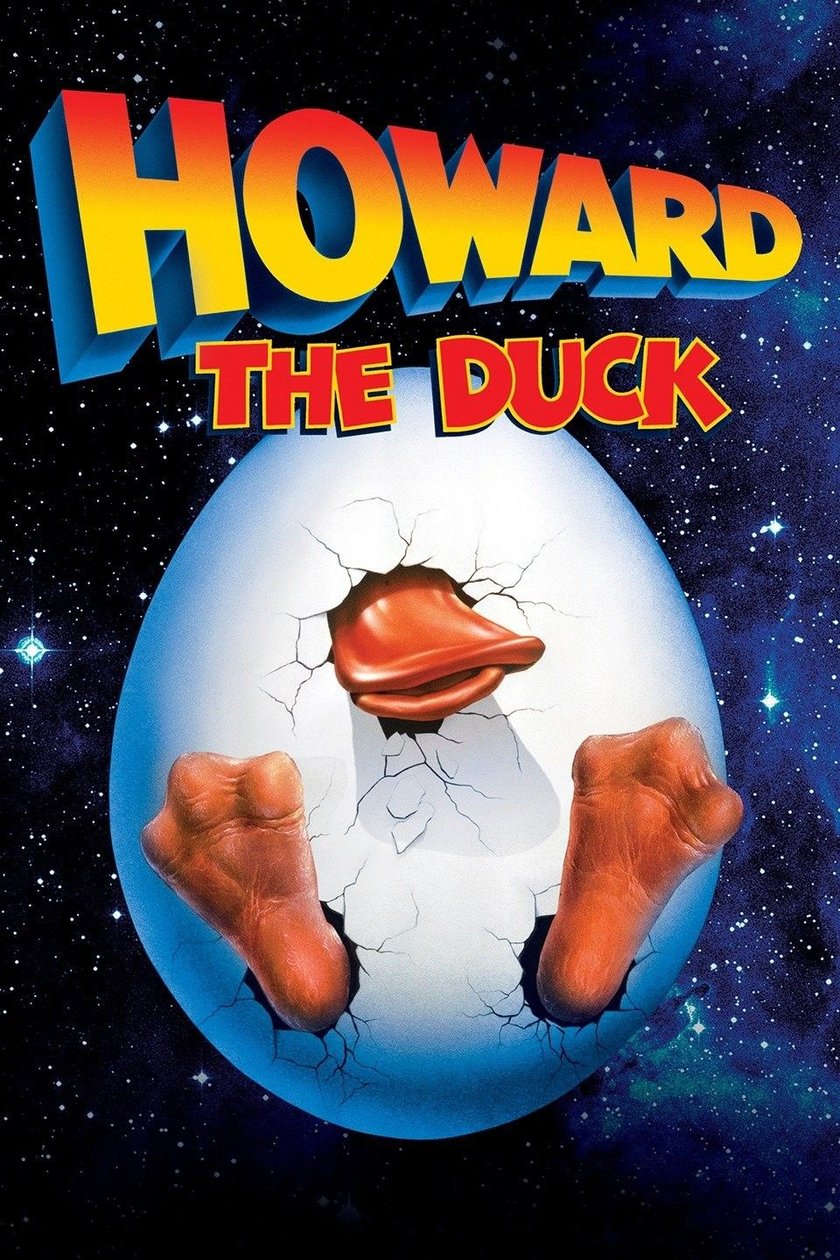 Filmplakat für „Howard the Duck“. Ein großes, Weißes, zerbrochenes Ei, aus dem ein orangefarbener Entenschnabel und zwei orangefarbene Entenfüße ragen. Der Hintergrund ist ein dunkler Nachthimmel mit vielen Sternen. Der Titel „HOWARD THE DUCK“ ist in großen, gelben und roten 3D-Buchstaben darüber geschrieben.