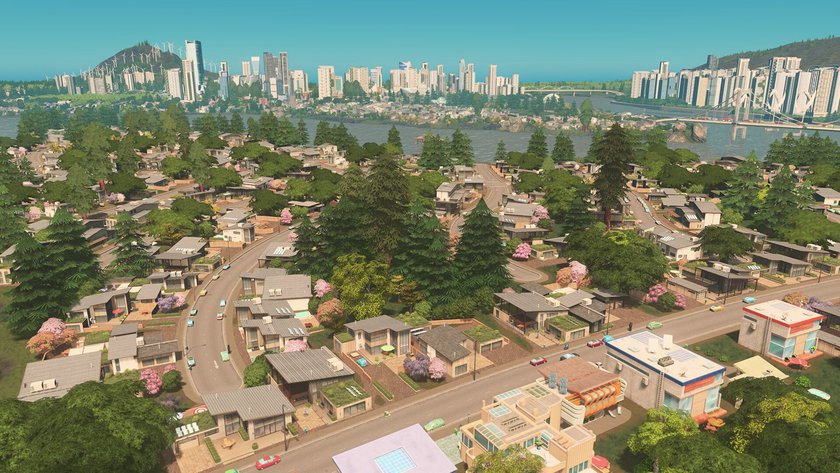 Gezeigt wird eine Stadt im Spiel Cities: Skylines am Tag.