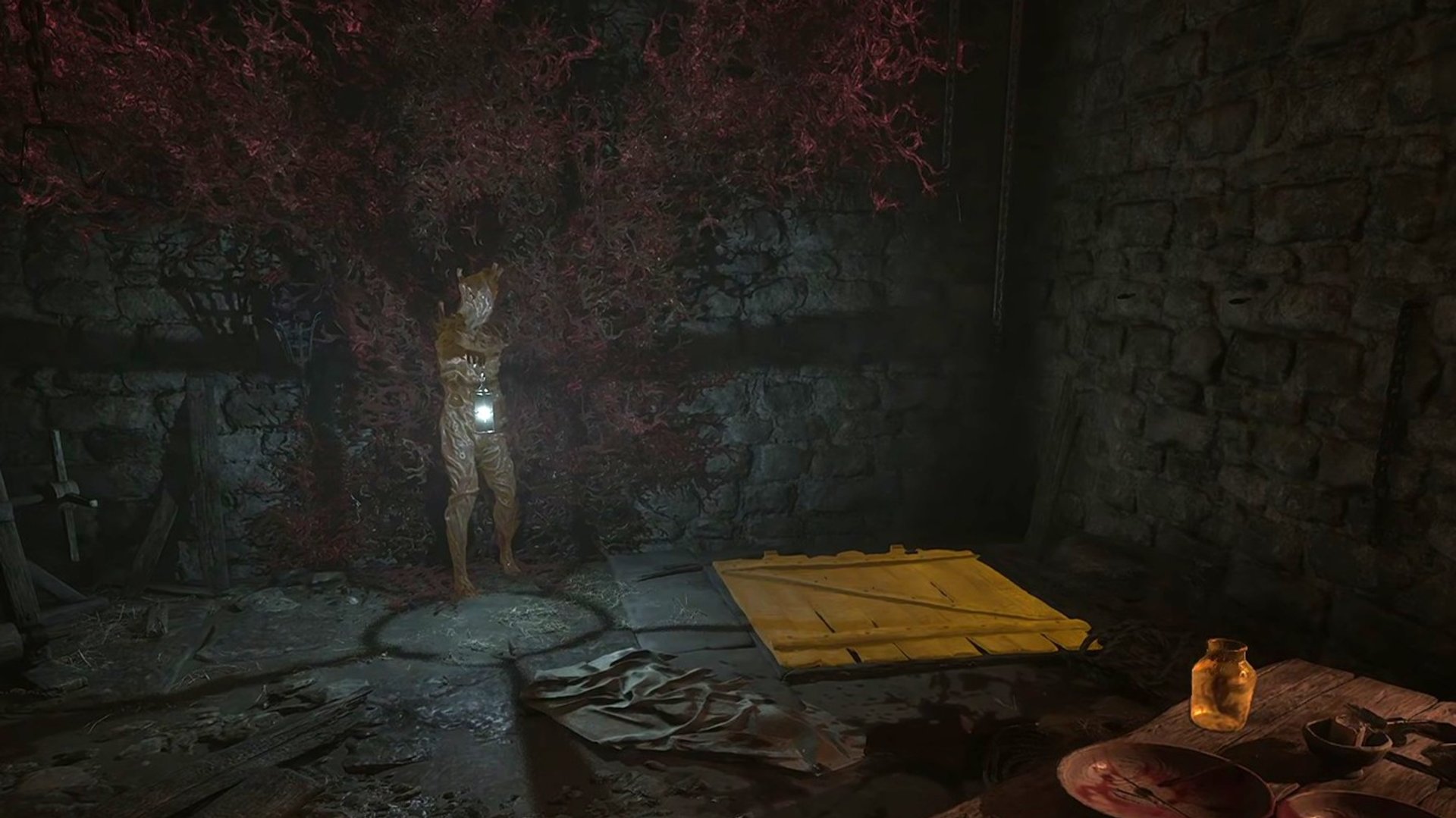 You will find a trap door next to the statue with the lantern.