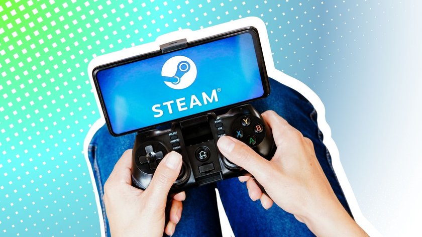 Eine Person spielt mit einem Joystick, während das Steam-Logo auf einem Smartphone-Bildschirm angezeigt wird.