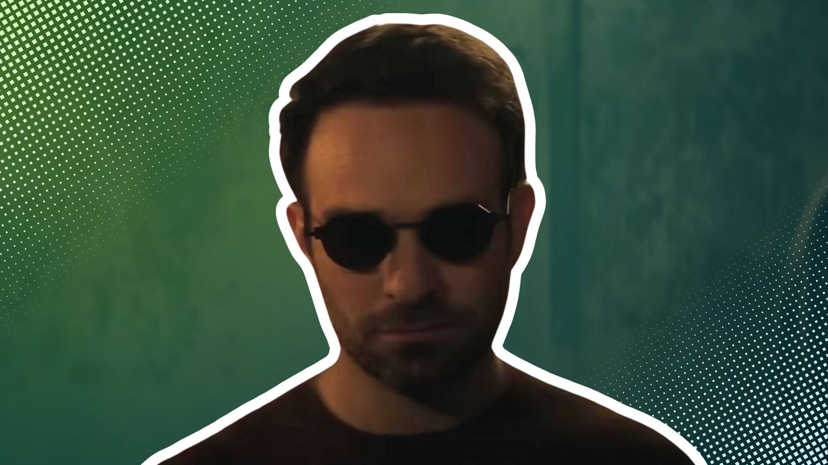 Das Bild zeigt Mad Murdock von den Schultern aufwärts. Er trägt eine runde schwarze Sonnenbrille und ist weiß umrandet. 