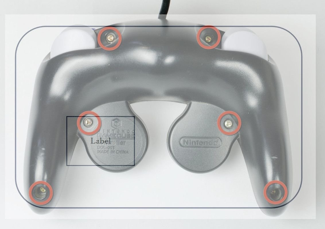 Zeichnung, die ein Viereck mit Platzierung einer Beschriftung zeigt, dahinter das Bild eines GameCube-Controllers.