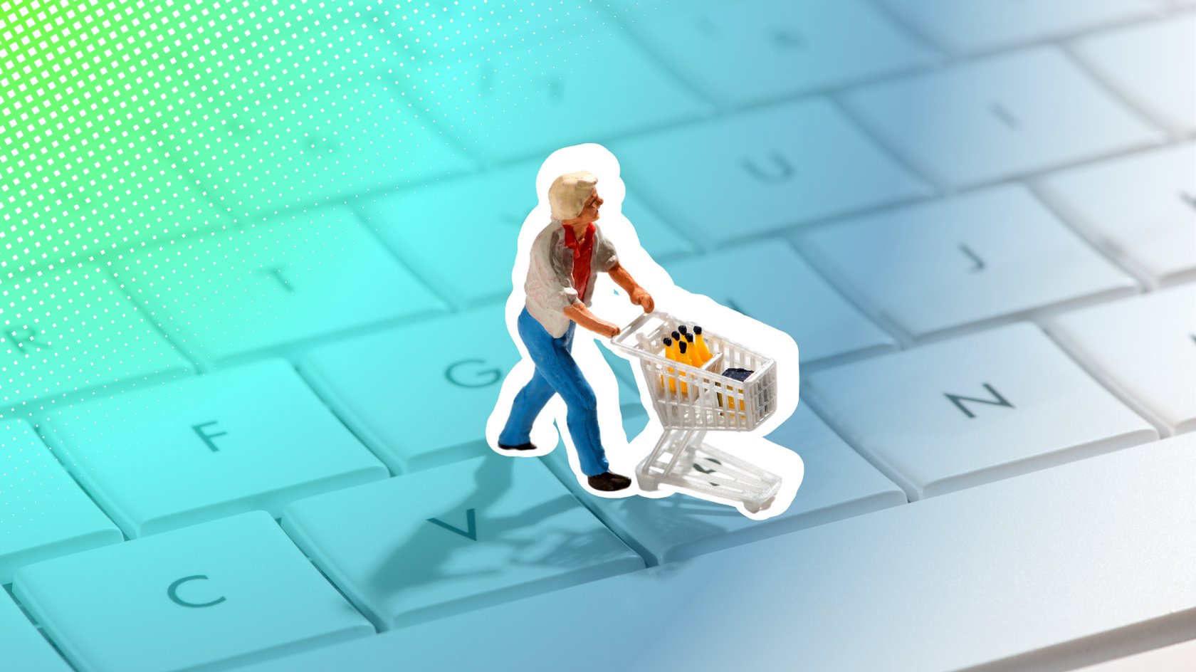 Abbildung einer Miniaturfigur, die einen Einkaufswagen mit Produkten schiebt, vor dem Hintergrund einer Computertastatur. Die Darstellung kombiniert die Themen Online-Shopping und Digitalisierung.