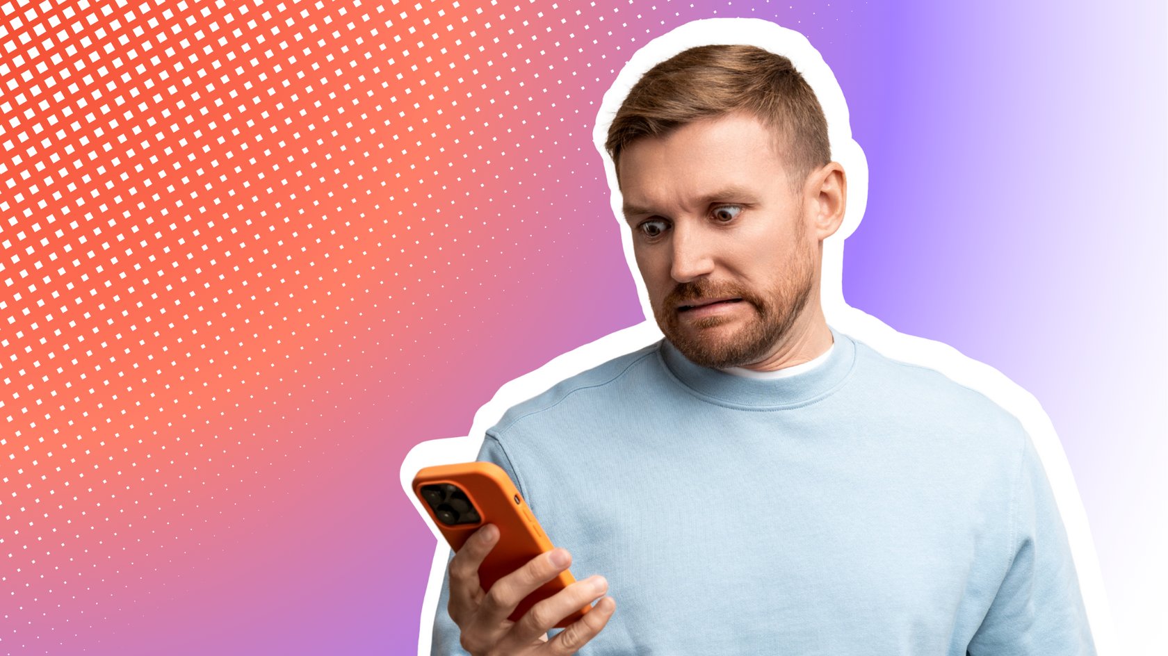 Ein Mann mit kurzem braunem Haar und Bart trägt einen hellblauen Pullover und hält ein Smartphone in der Hand. Er schaut mit einem besorgten oder erschrockenen Gesichtsausdruck auf den Bildschirm