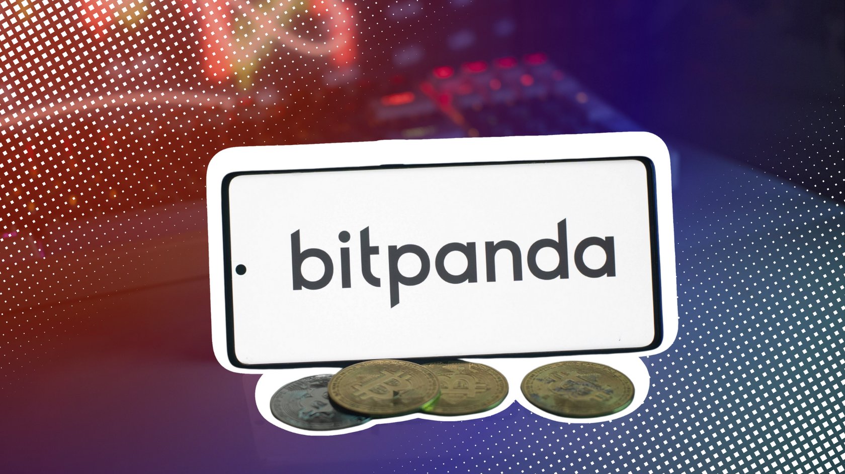 Bitpanda-Logo auf weißem Bildschirm mit Münzen und Handelsgraphen im Hintergrund.