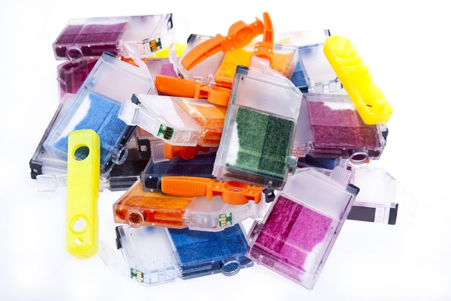 Colorful pile of inkjet printer ink cartridges
