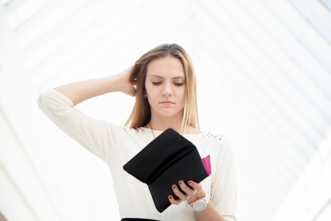 Upset Young Woman out of Money