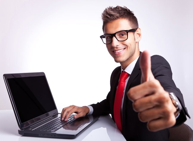 side view of a business man working on laptop