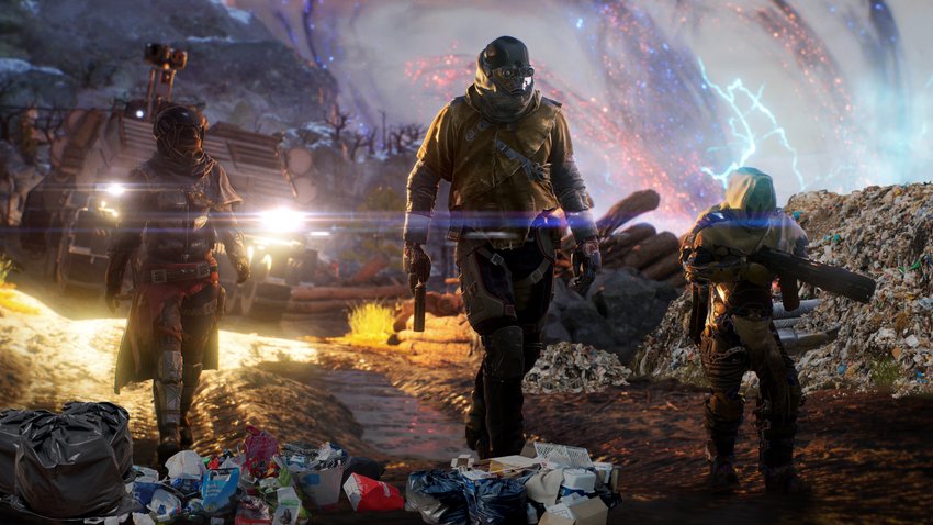 Drei Charaktere aus Outriders laufen durch Müllberge.