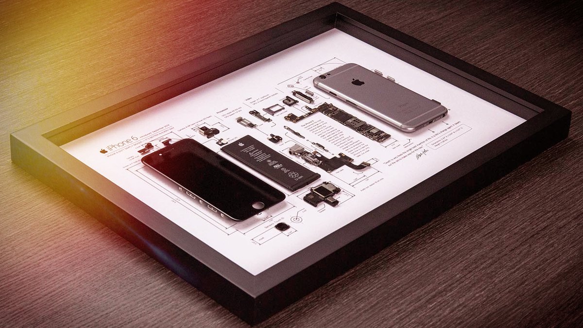 iPhone disassembled and under glass: ingenious wall decoration for Apple fans