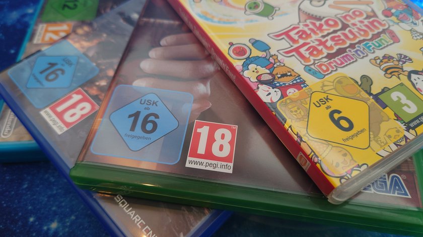 PEGI- und USK-Symbole auf verschiedenen Spielepackungen