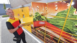 Pakete bei Burger King abholen: DHL stellt Packstationen bei Fast-Food-Kette auf