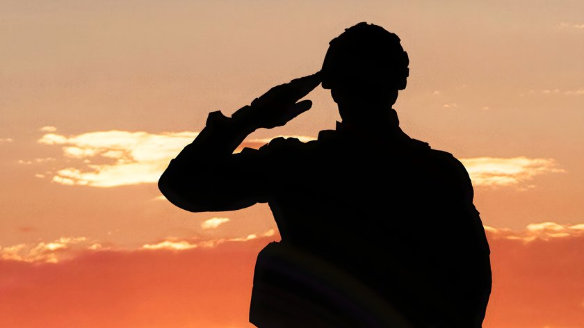 Silhouette Of A Soldier Saluting During Sunset